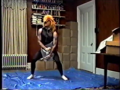 wearing black tights crop top, stocking mask hump pillow 1990's