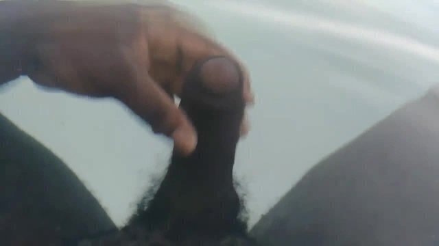 Thick black dick jerks under water