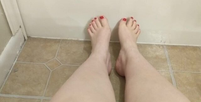 Pretty toenails. Rubbing feet