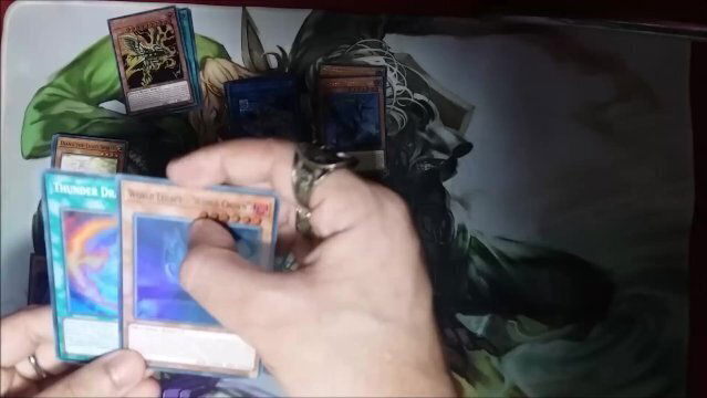 Yugioh Unboxing Gold Sarc MegaTin! card included?