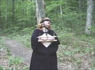 BBW has hard bondage in the forest.