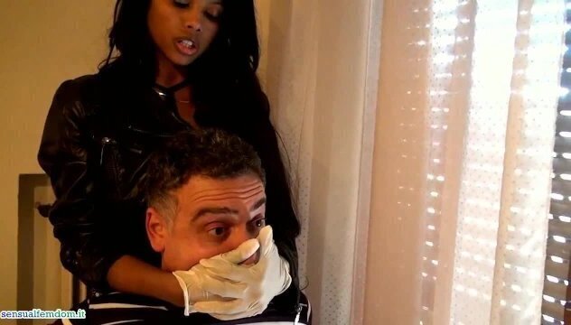 Janelle handsmothers her with surgical gloves on