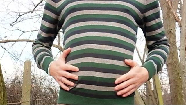 Twink belly grows under sweater outside belly inflation