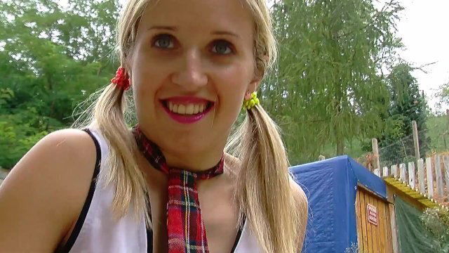 Blond schoolgirl Katie drives her bicycle and masturbates in her garden