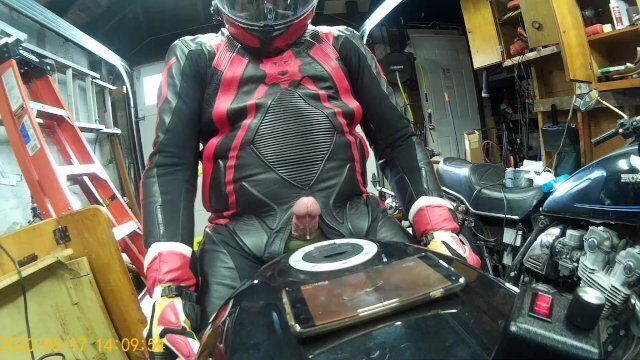 Leather biker milked motorcycle