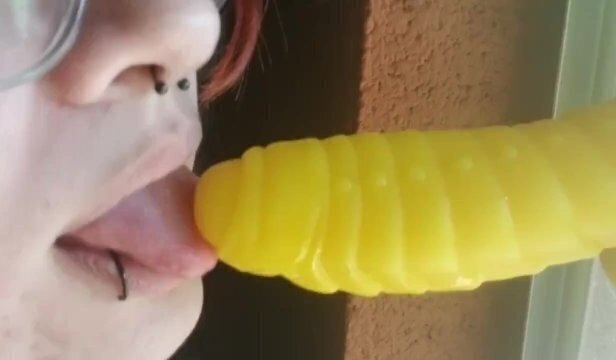 Goth with piercings gives close blowjob