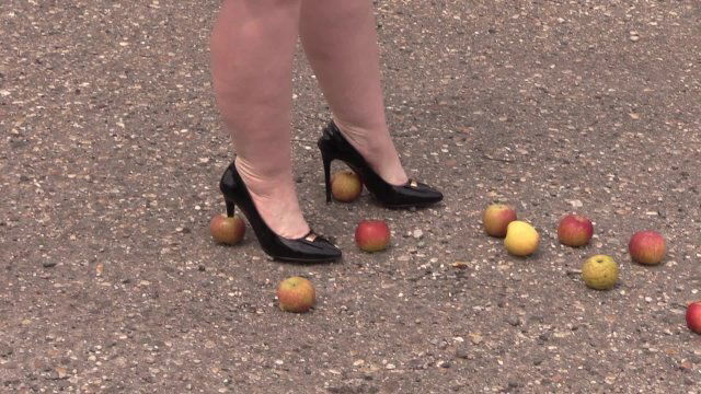 Crush fetish outdoors legs heel shoes crush apples