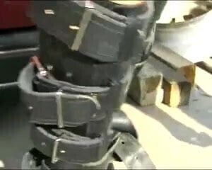 Leather-clad Milf is tied up and fucked in car cemetery