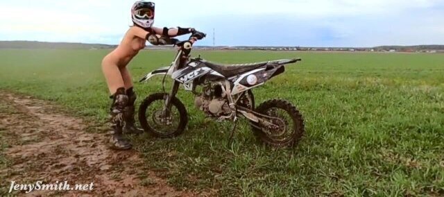 Naked woman riding Dirt Bike
