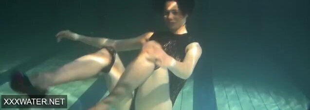 Shaved brunette Irina Polcharova naked pool