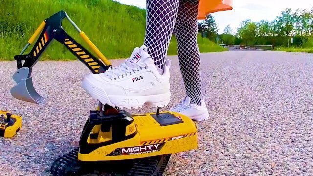 excavator destroyed kicked, trampled, crushed, smashed, crushed, broken plastic car, crush