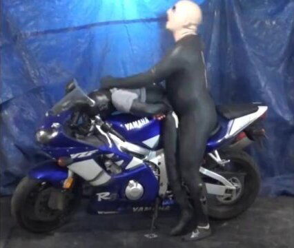 having some sitting motorcycle with dummy