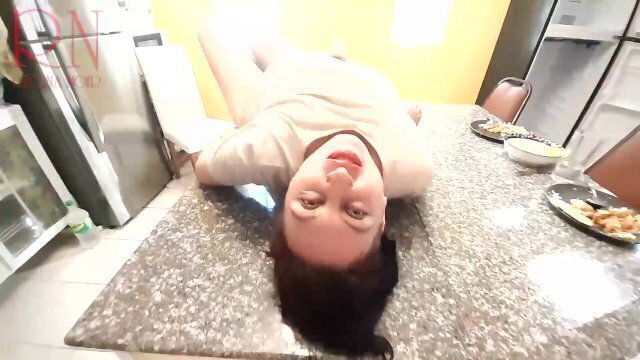 Housewife stripping kitchen desk