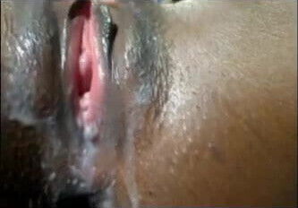 Horny black bitch strokes creamy pussy