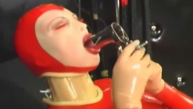 Sexy girl encased rubber catsuit loves medical games with mouth spreader nipple clamps