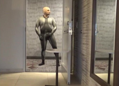 showing dolphin wetsuit bulge silicone mask hotel door window,
