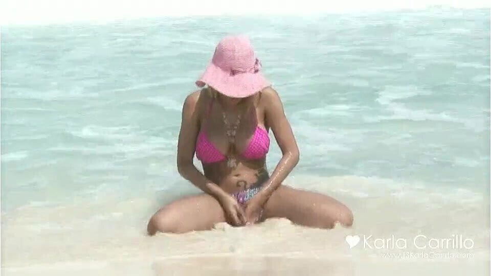 At the beach in pink