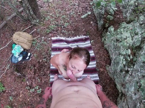 Redhead with big boobs sucks dick and swallows load in the woods