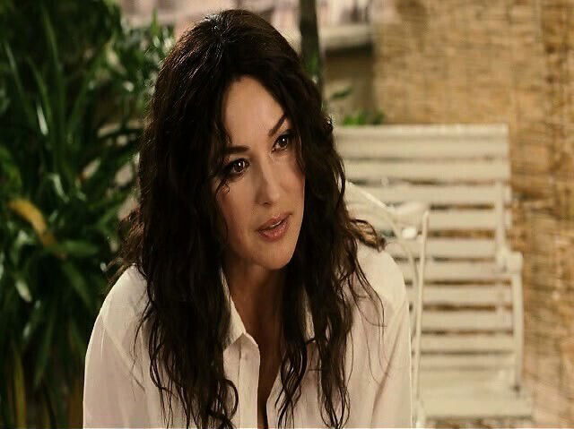 Monica Bellucci skimpy black dress shows plenty