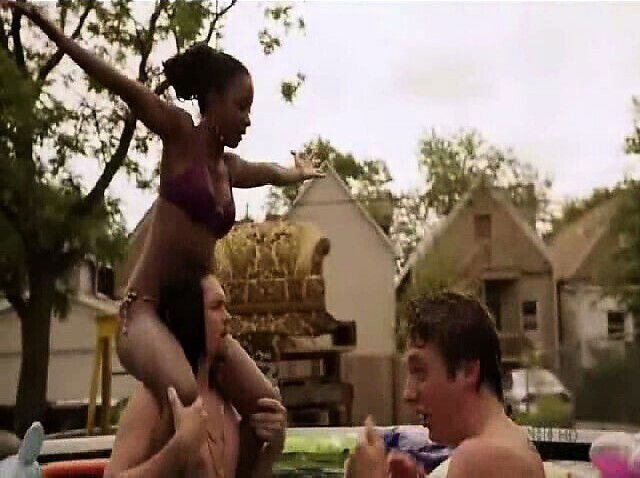 Emma Greenwell showing bare breasts with shirt hiked