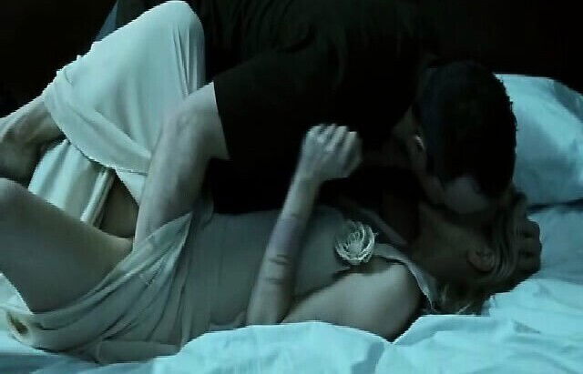 Maria Bello lying naked bed,her hands bound above