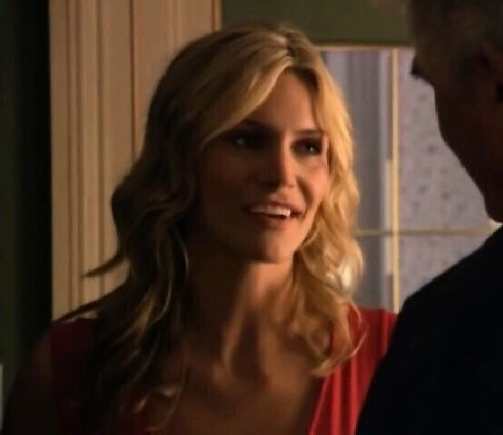 Natasha Henstridge opening coat reveal some