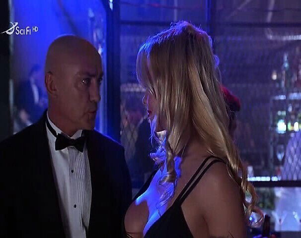 Pamela Anderson topless squeezing amazing breasts