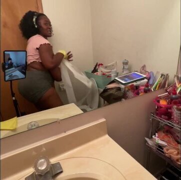 Ebony cleaning nipples hanging shirt