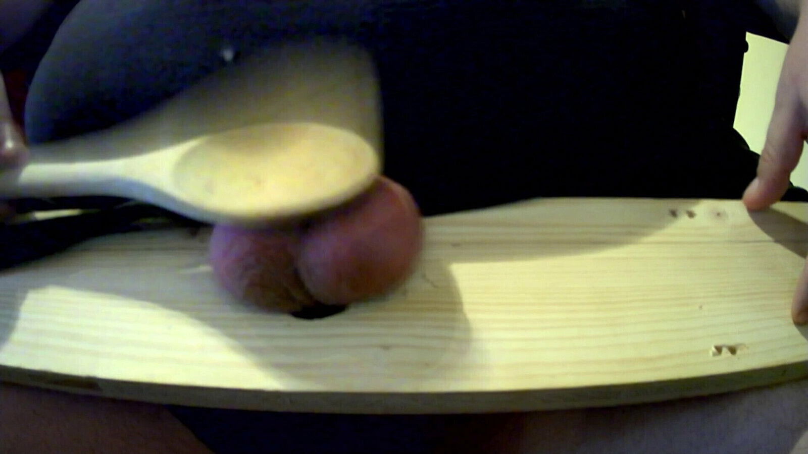 Ballbusting with wooden spoon