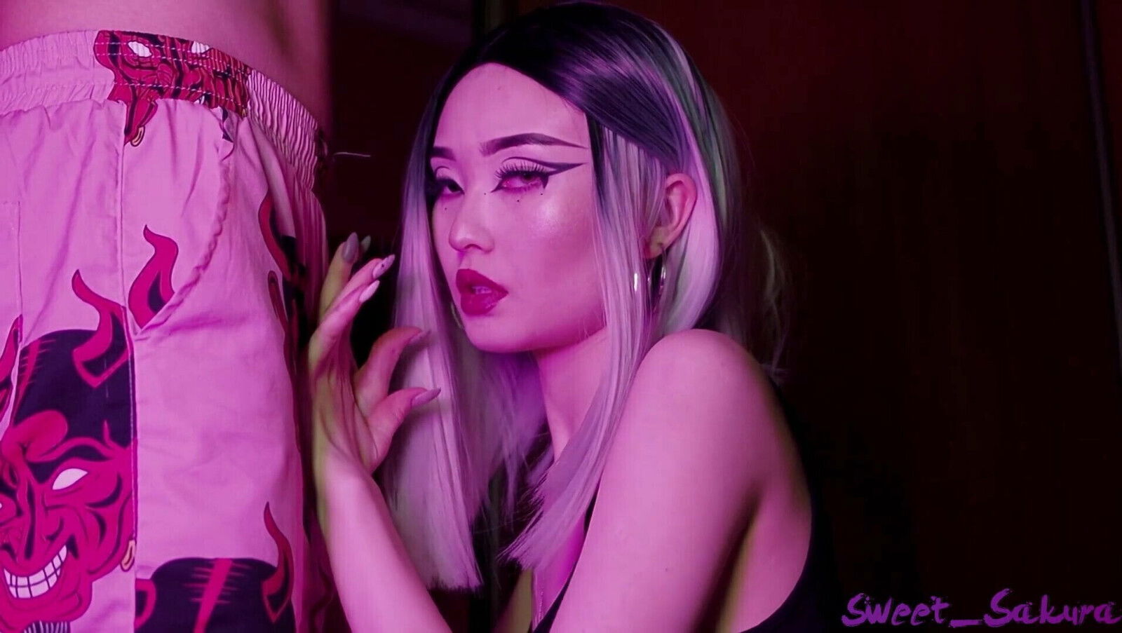 Sweet Sakura sucks dick purple light