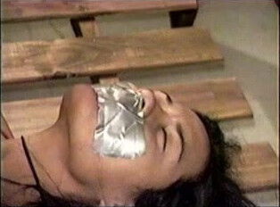 Bedtied, tape gagged hooded