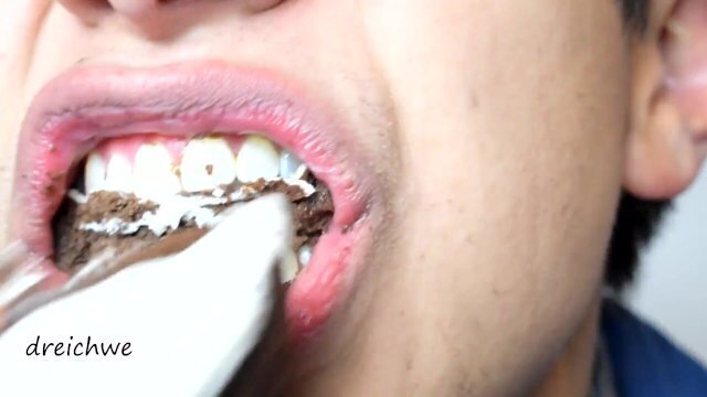 Eating delicious black cupcakes