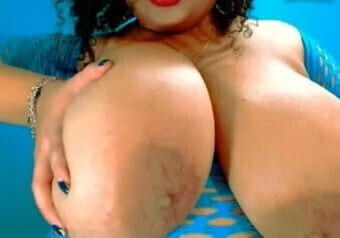 Huge breasts on Latino Goddess as she pinches nipples