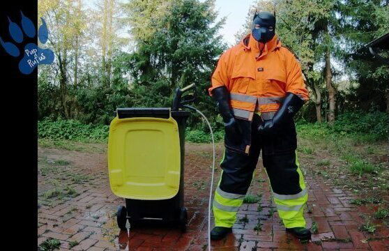 Raingear pawing outdoors after work