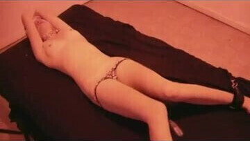 Tied beauty with dildo panties