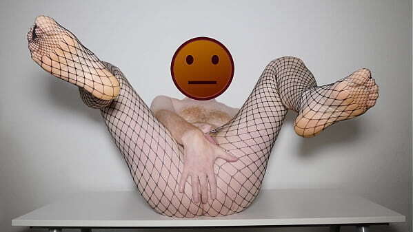 Posing stripping black fishnet pantyhose tights