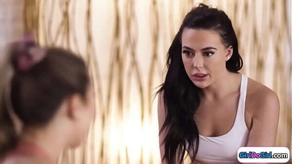 Yoga teacher squirting students mouth