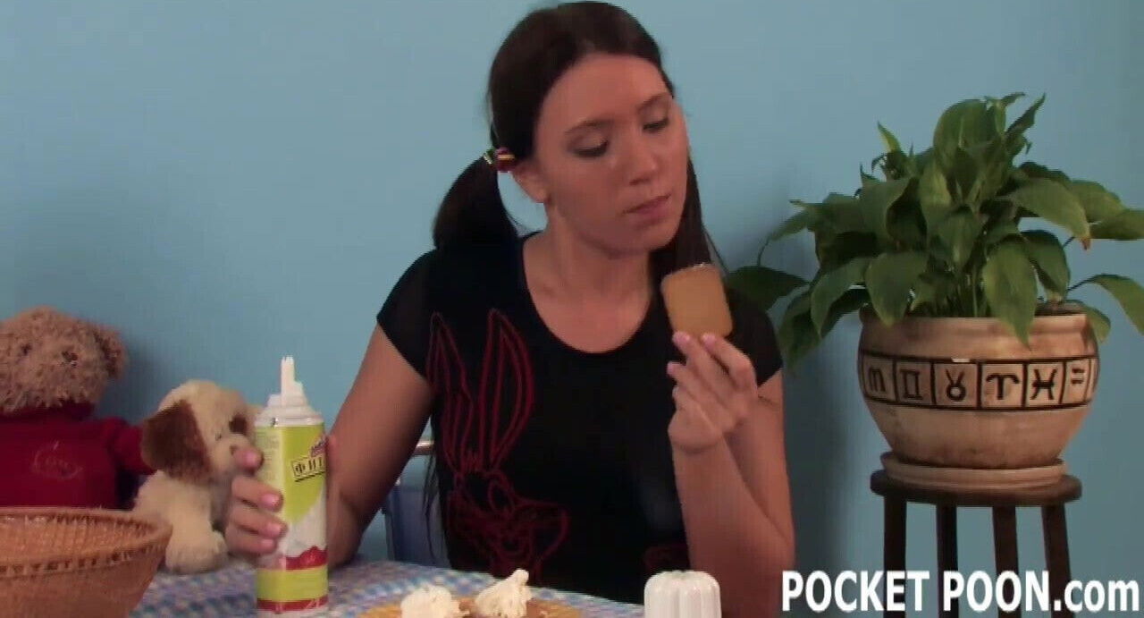 Pigtailed teen covered whipped cream