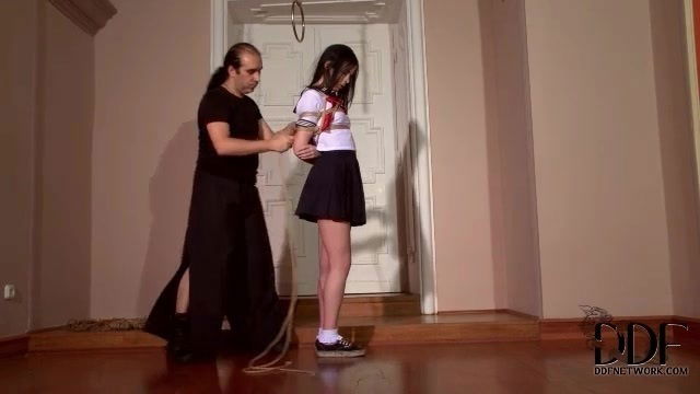 Schoolgirl stands still body tied