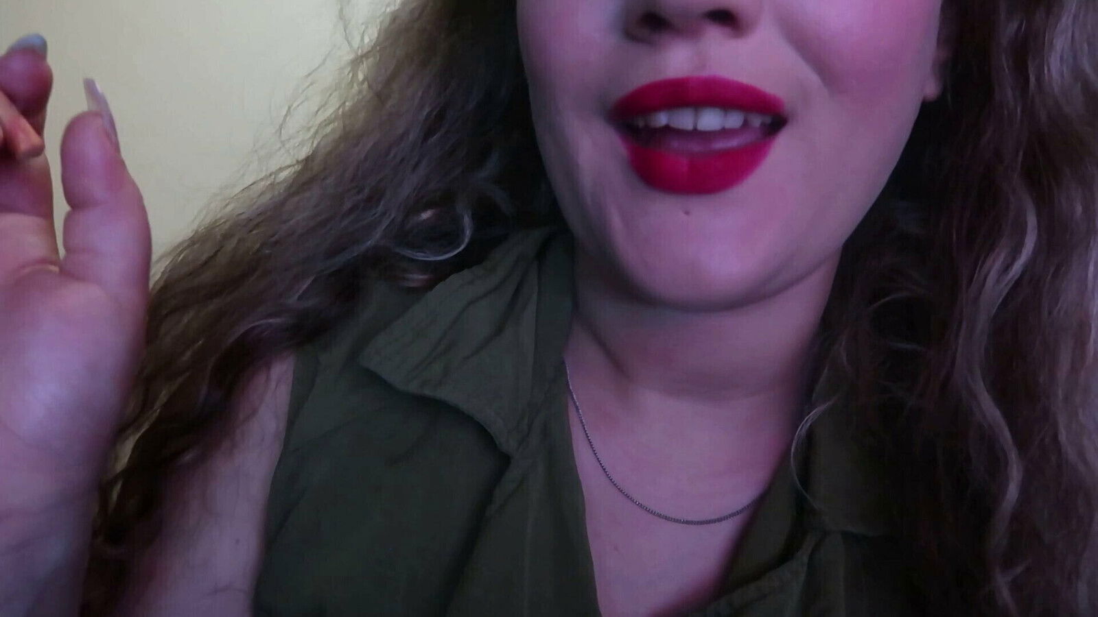 CUTE WOMAN PAINTS LIPS SMOKES CIGARETTE