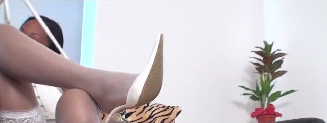 Lucy offers Dangling finest white stockings with white open pointed Heels.