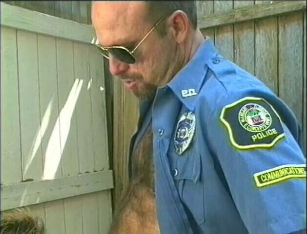 Muscular uniform wearing glasses sucks blows