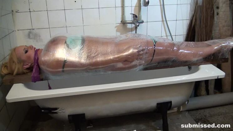 Vicky wrapped plastic gagged