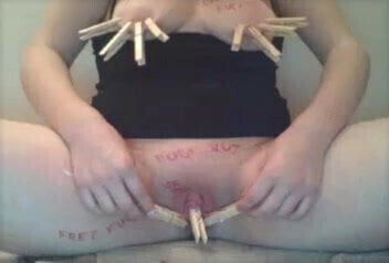 Slut clamps her nips and clit and slaps self 