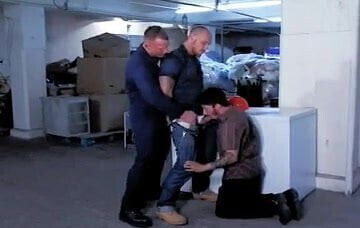 Boy by SEARS workers in the store's basement