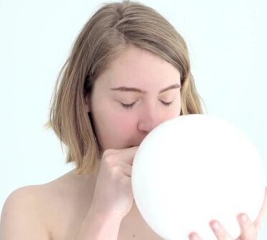 looner blowing popping first balloon