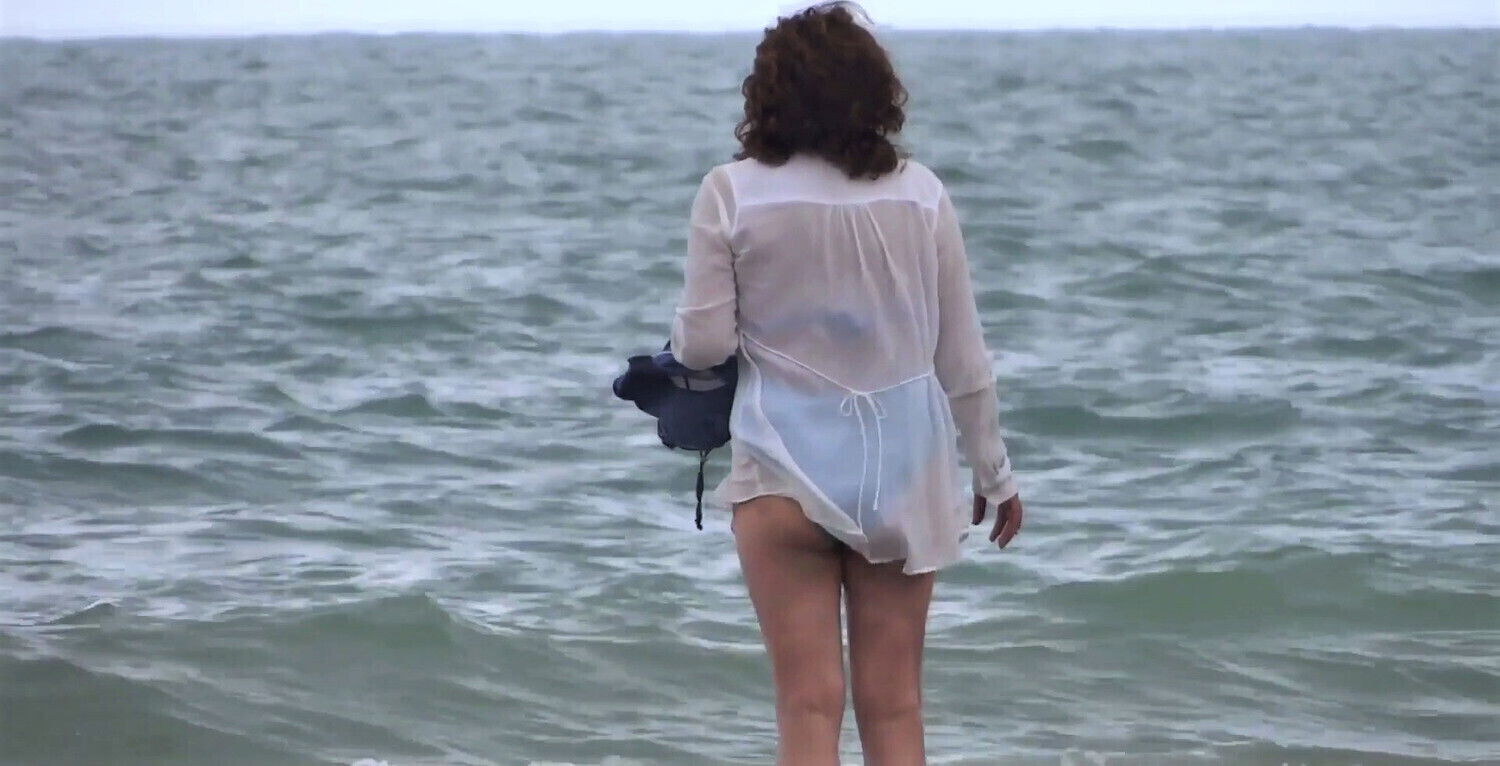 wife shows beach with friend