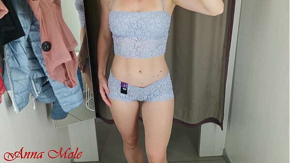 girl with perfect figure fitting room trying different beautiful lingerie.
