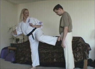 Female Black Belt demos break balls