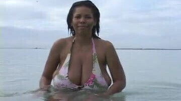 Busty Dominican MILF at the Beach (softcore)